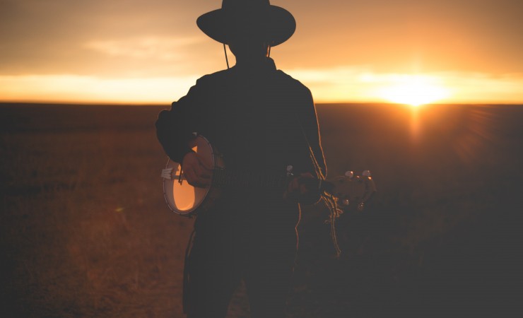 Banjo Player in the Sunset